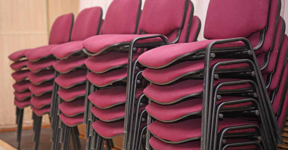 suppliers stack red chairs room